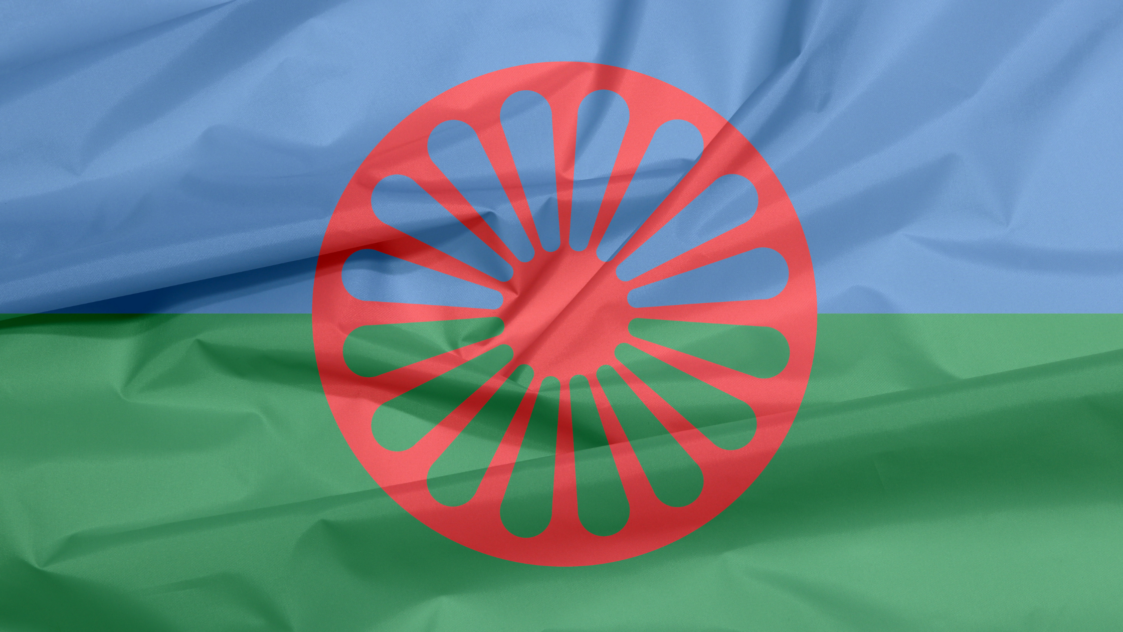 Rad als Symbol für Rom:nja und Sinti:zza